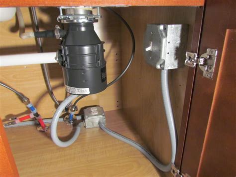 electrical box under kitchen sink|under sink electrical box.